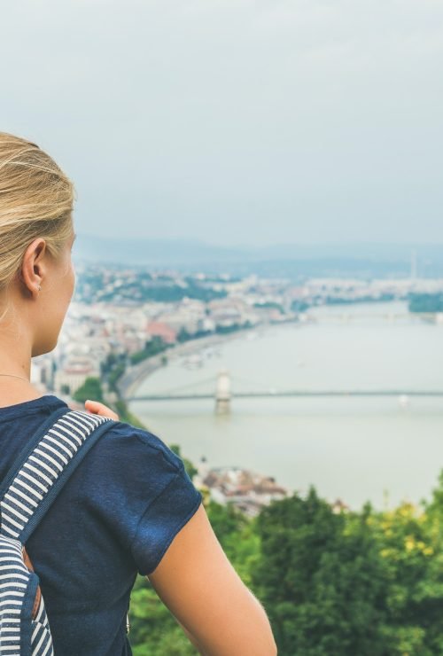 young-woman-traveler-looking-at-danube-river-budapest-hungary.jpg